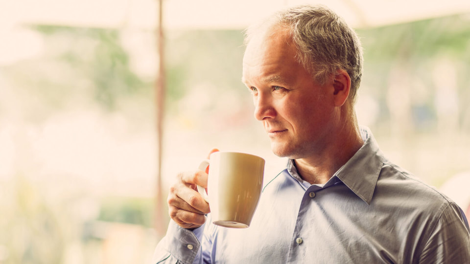Closeup of Pensive Middle-aged Man Drinking Tea